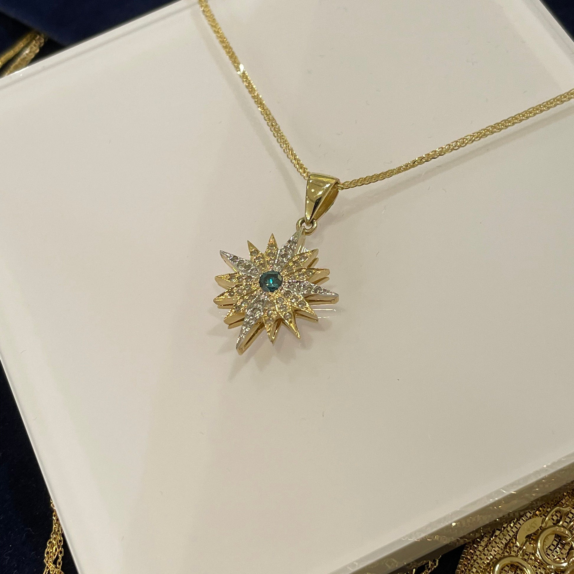Radiant Star of Bethlehem Pendant in 14k Gold with White and Blue Diamonds