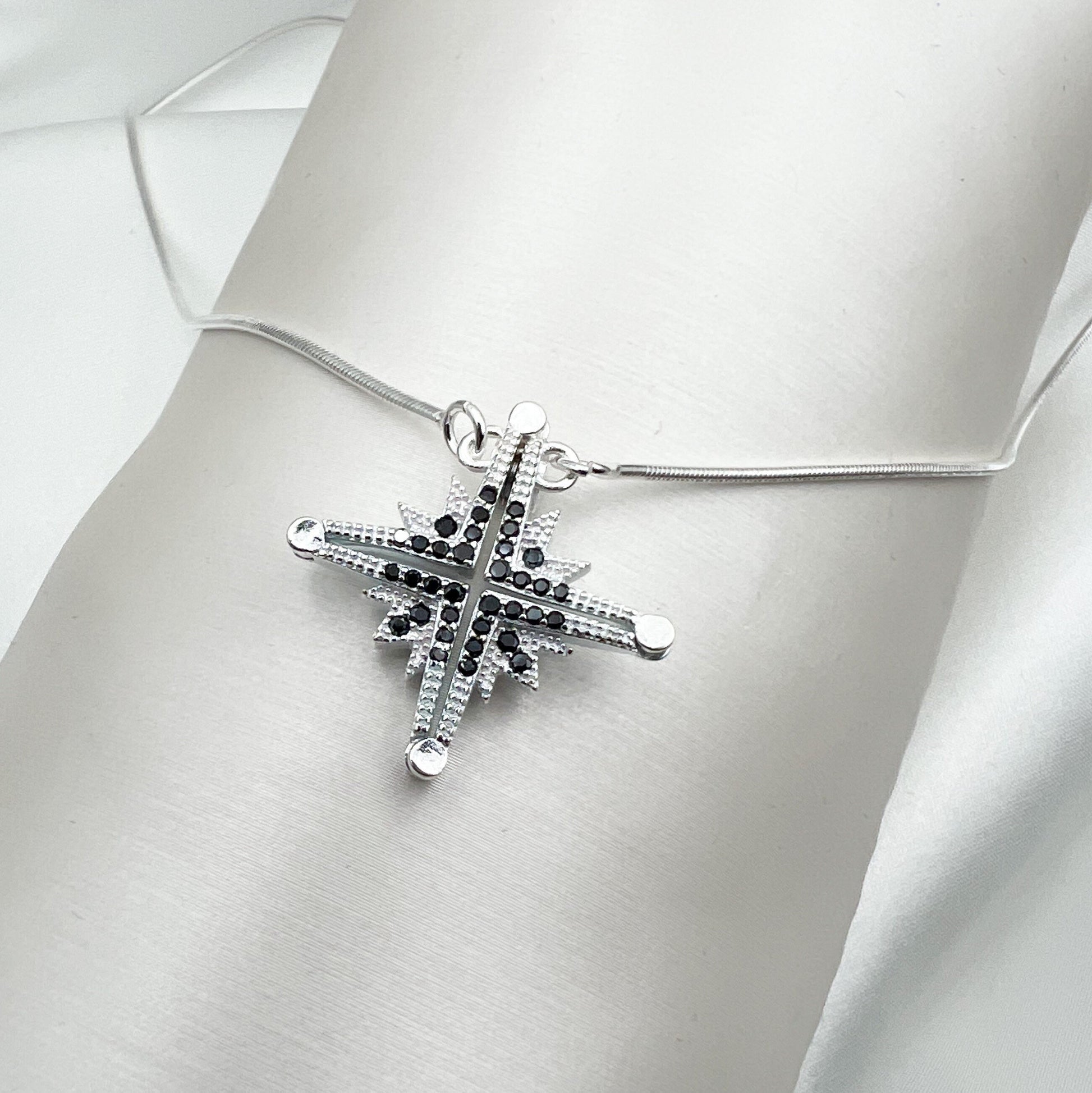 Star of Bethlehem Opening Pendant in Sterling Silver with Black Onyx