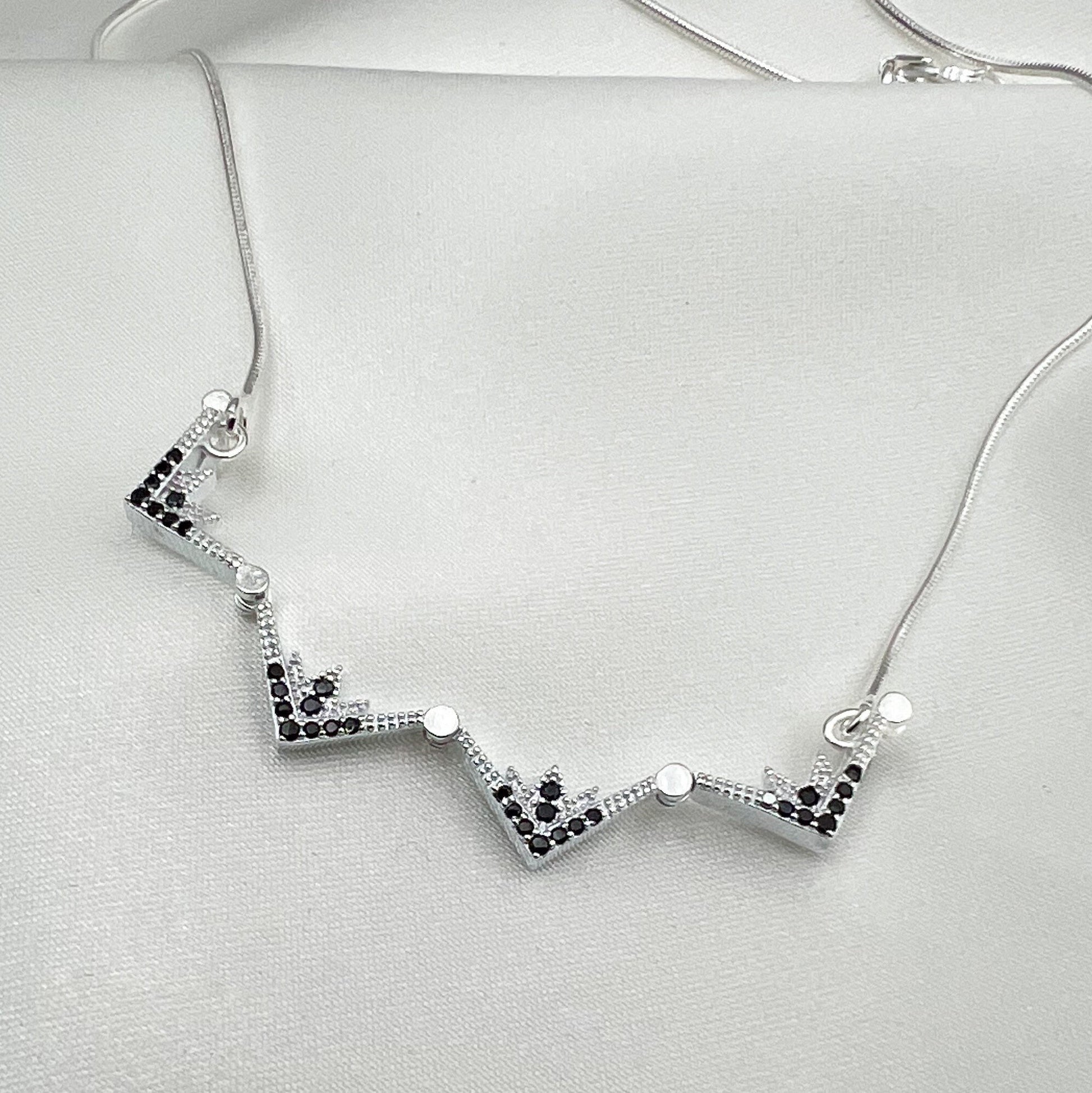 Star of Bethlehem Opening Pendant in Sterling Silver with Black Onyx