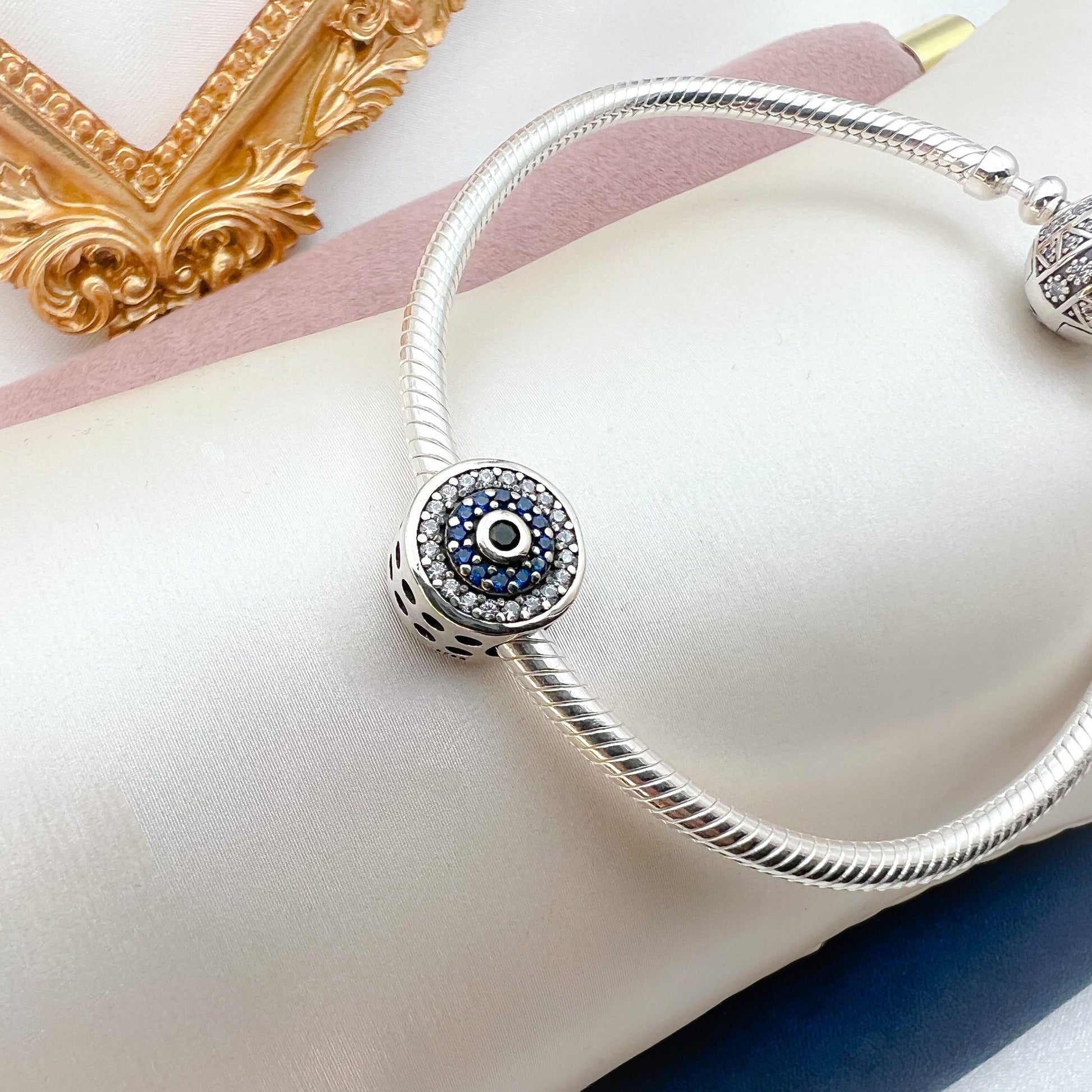 Elegant 925 Silver Evil Eye Charm with Blue Sapphire Accents for Bracelet Lovers