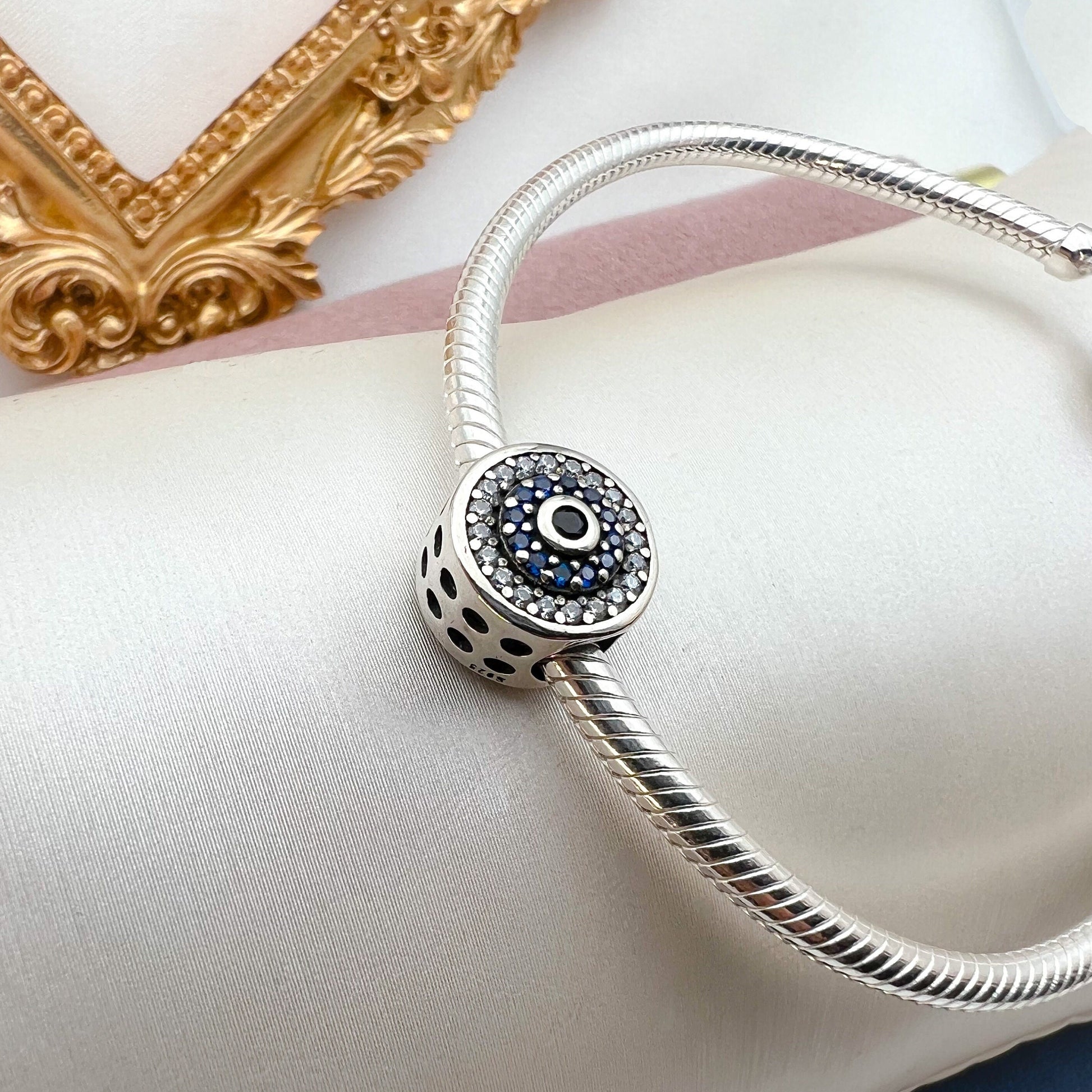 Elegant 925 Silver Evil Eye Charm with Blue Sapphire Accents for Bracelet Lovers